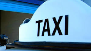 Two men try to flee from moving taxicab