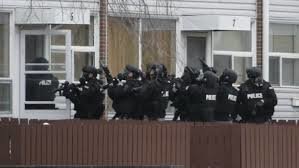 Armed men barricaded in the house near the school