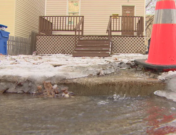The taps are dry but water continues to flow down the street in Winnipeg